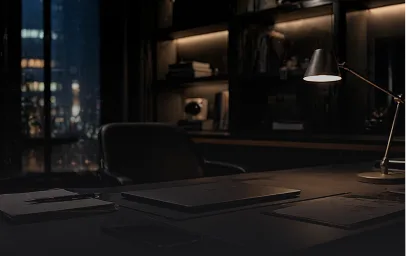 Executive office workspace at night with city view and controlled lighting