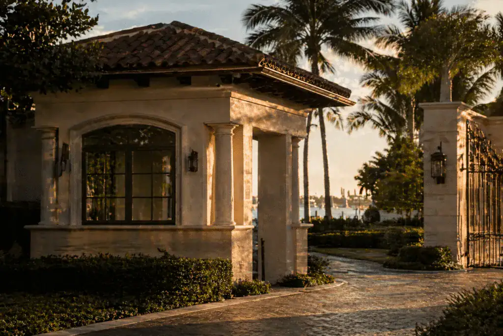 Mediterranean-style guardhouse and gated entry on Palm Beach Island