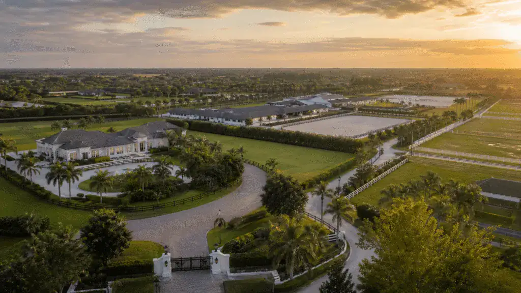 Aerial view of a large equestrian estate at sunset in Wellington
