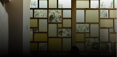 Frosted glass window panels providing privacy and light diffusion