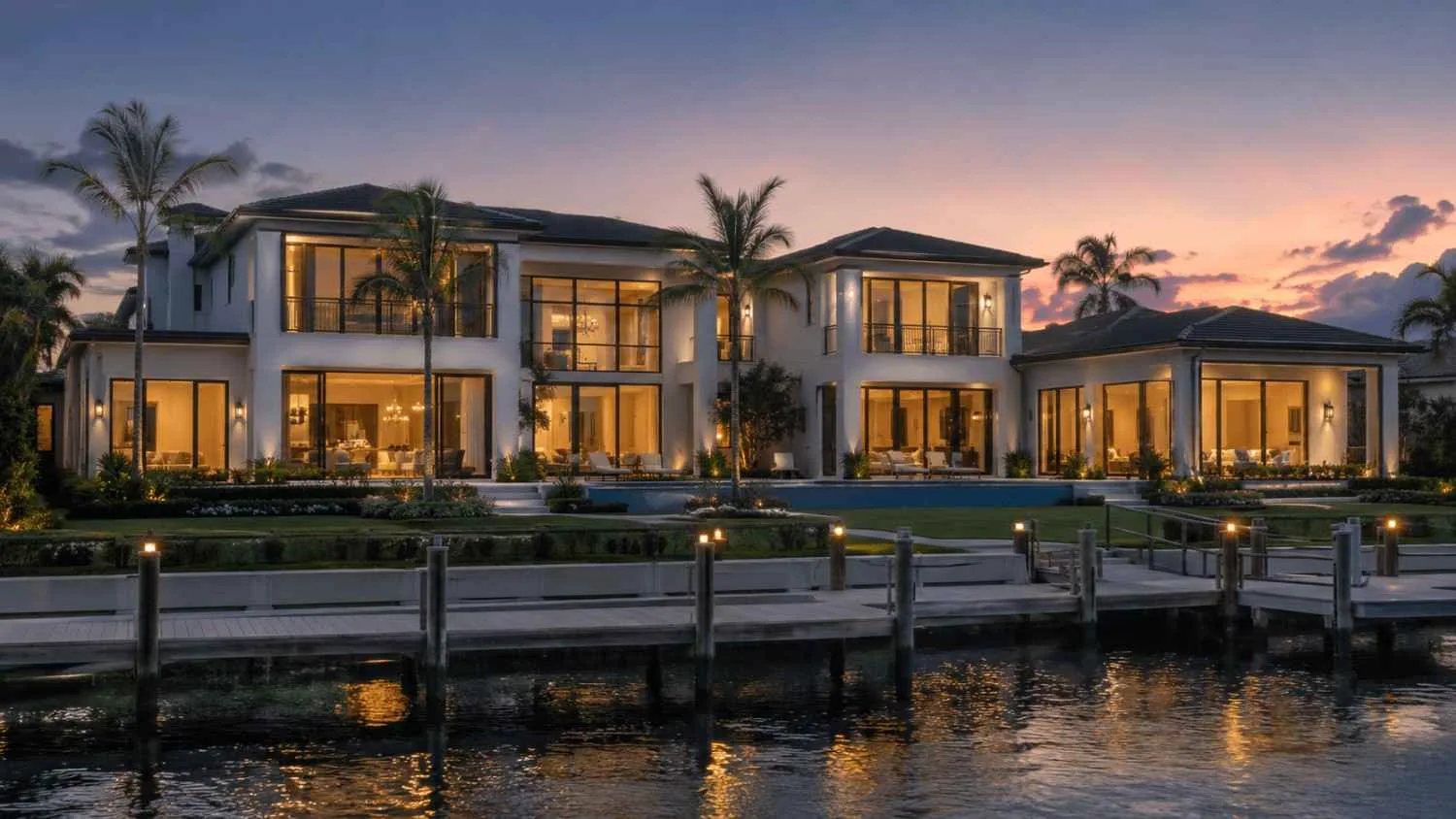 Twilight luxury waterfront home view