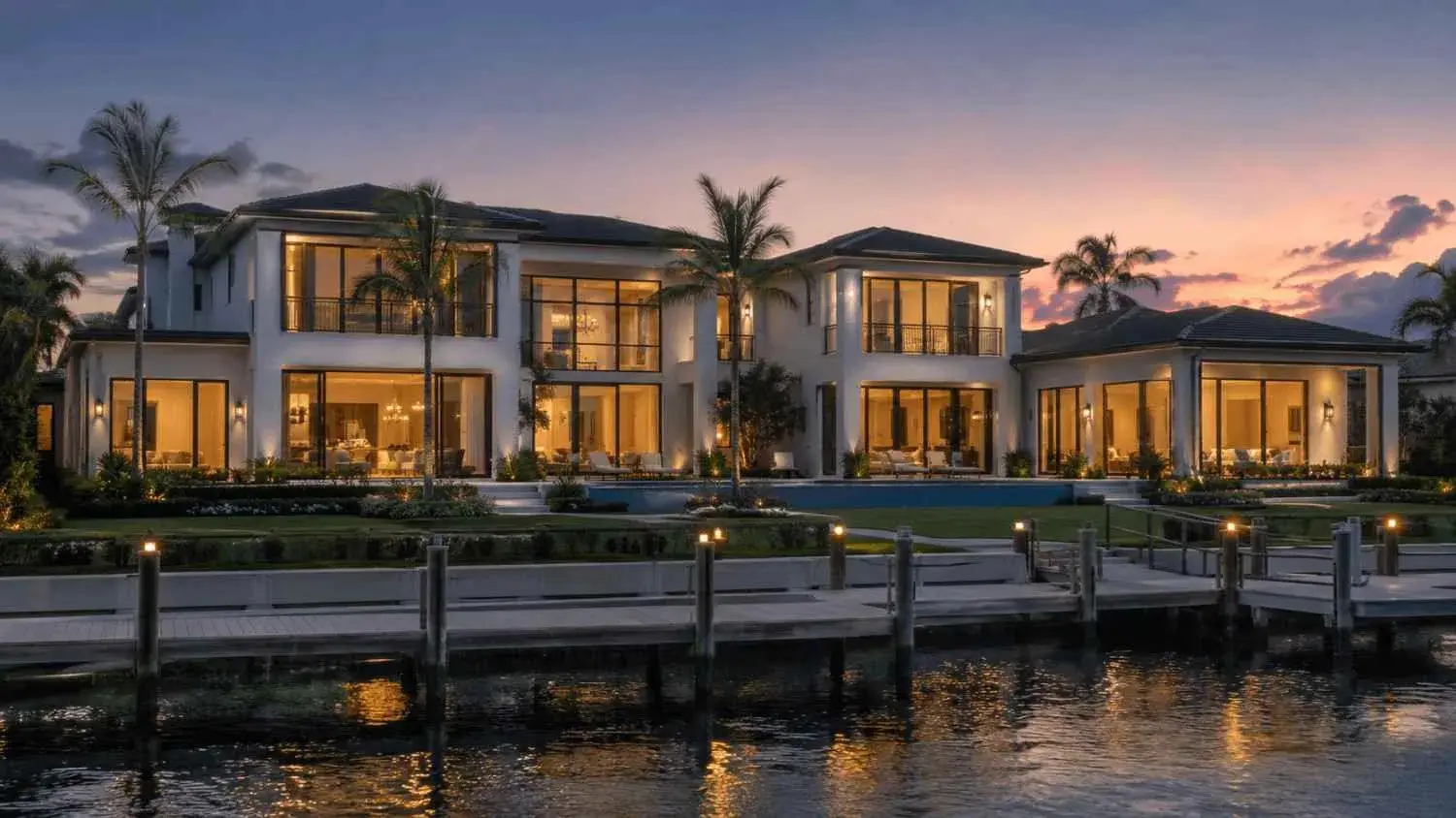 Twilight luxury waterfront home view