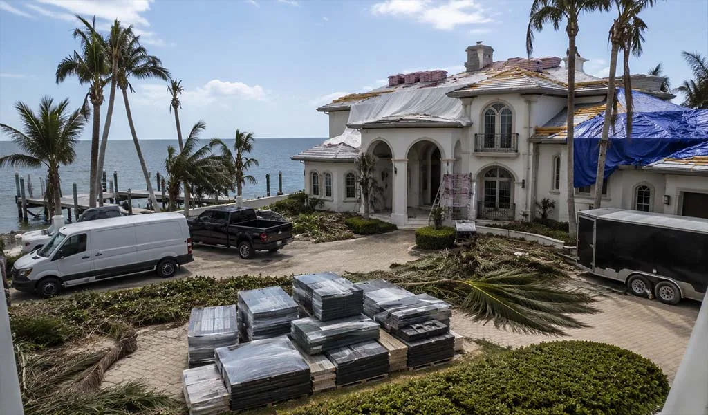 Luxury Naples estate undergoing organized post-hurricane recovery and restoration