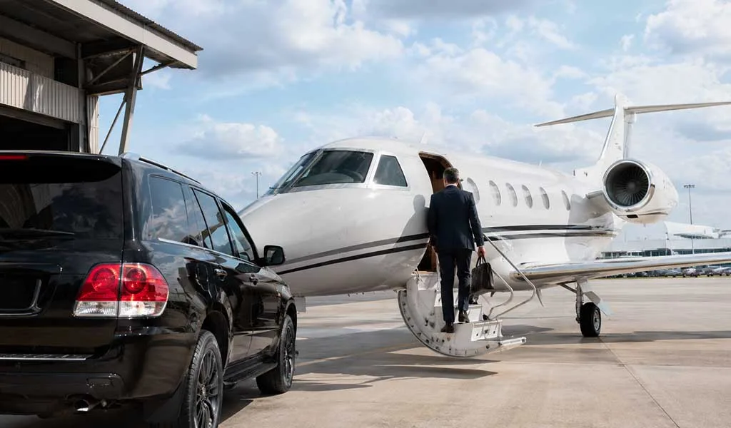 Business executive boarding a private jet for seasonal travel between New York and South Florida.