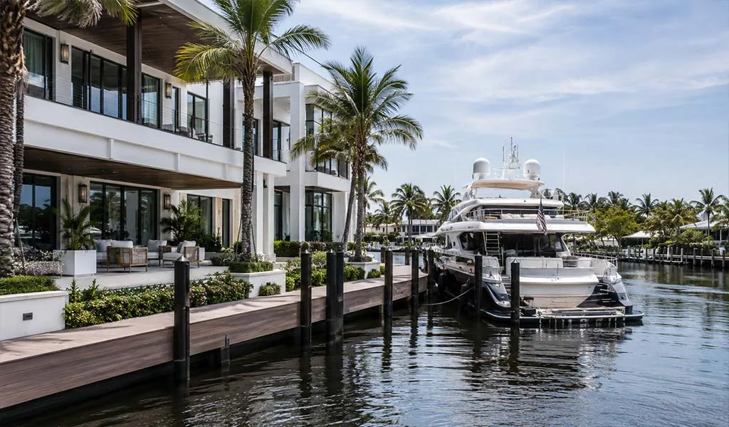 Luxury waterfront estate with private superyacht along a Fort Lauderdale canal