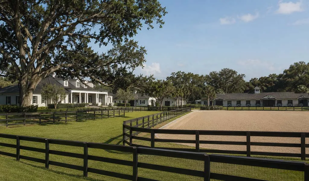 Luxury Wellington equestrian estate with barns and riding arenas during the quiet off-season