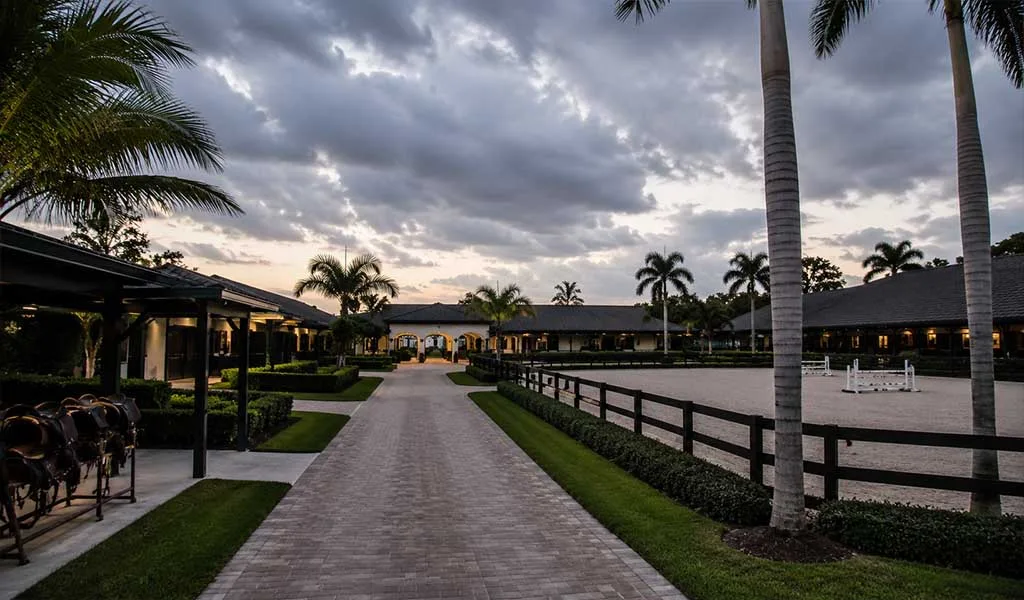 Luxury Wellington equestrian estate with barns and paddocks prepared before hurricane season.